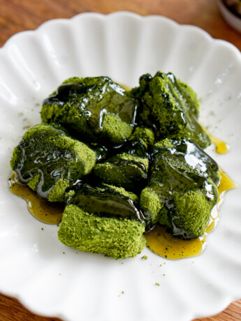 matcha warabimochi on a plate with syrup