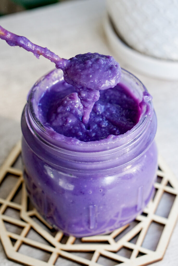 purple Okinawan sweet potato jam with spoon in jar