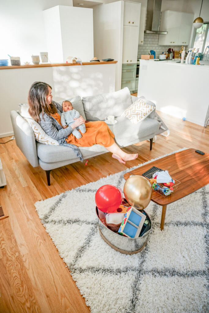 Mom and baby in open floor plan mid century house 