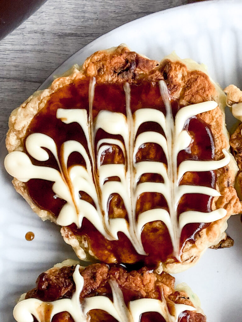 mini okonomiyaki with okonomiyaki sauce and japanese mayonnaise on top