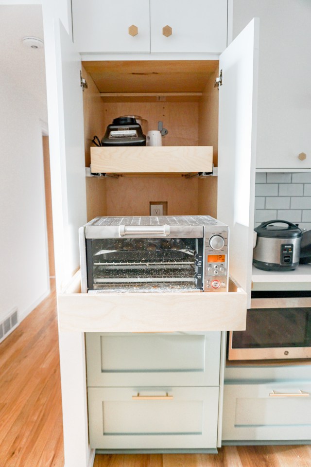 appliance garage in the kitchen made from a cabinet