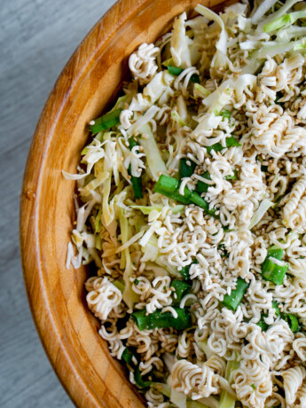 ramen cabbage salad overhead view in wooden bowl